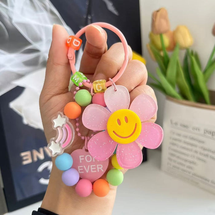 Wholesale Cute letter sunflower bag pendant with smiling face, colorful handmade bead key chain