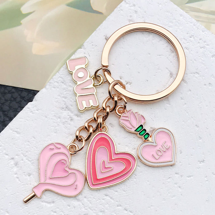 Wholesale Cute pink heart-shaped rose potion metal  keychain
