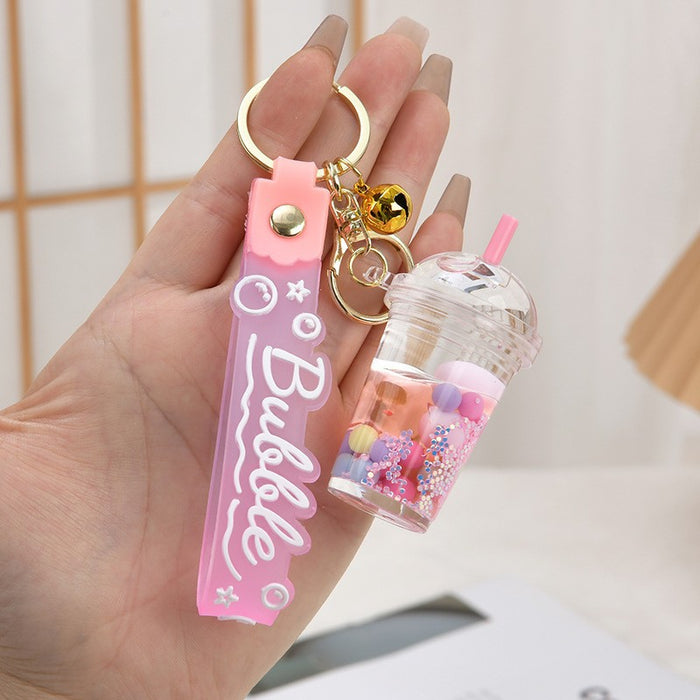 Wholesale Acrylic oil bottle candy Bean astronaut keychain