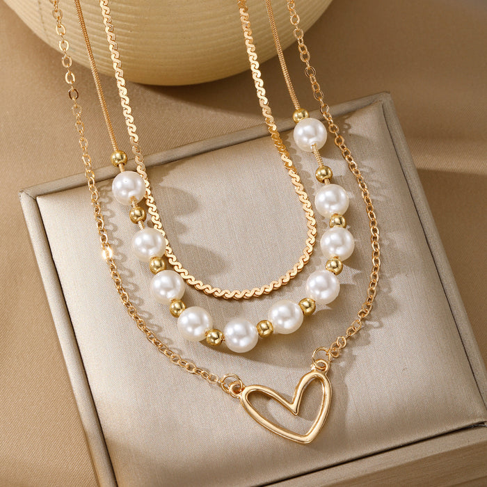 Wholesale Fashionable imitation pearl heart-shaped hollow pendant necklace, exquisite, high-end, versatile, multi-layer stacked collarbone chain