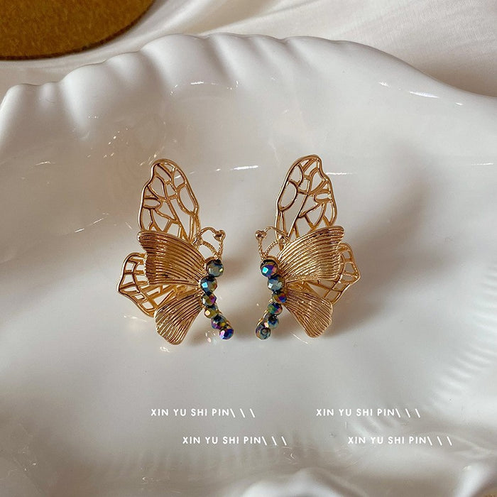 Wholesale Sparkling diamond dynamic hollow butterfly tassel earrings, light luxury temperament, high-end feeling, niche earrings, exaggerated earrings