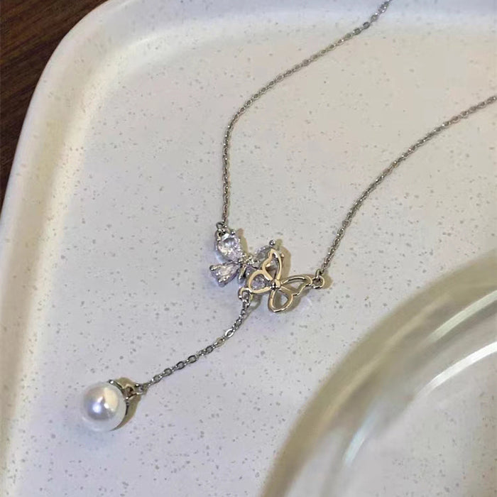 Wholesale Titanium steel micro inlaid jewelry hollow butterfly collarbone chain pearl tassel pendant light luxury accessory