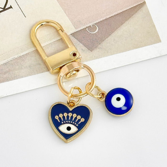 Wholesale Diamond-encrusted blue eyes evil eye tassel keychain