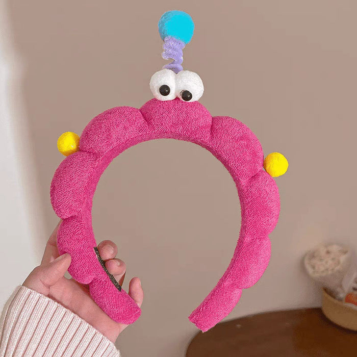 Wholesale Cute girl' s twistable hairband with big-eyed plush toy design.