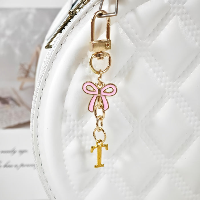 Wholesale Pink bow A-Z keychain alloy accessory