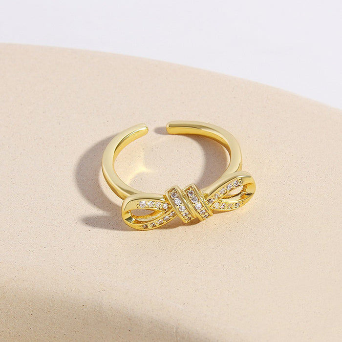 Wholesale Copper Gold Plated Irregular Zircon Twisted Rope Bow Ring JDC-RS-BaiTian004