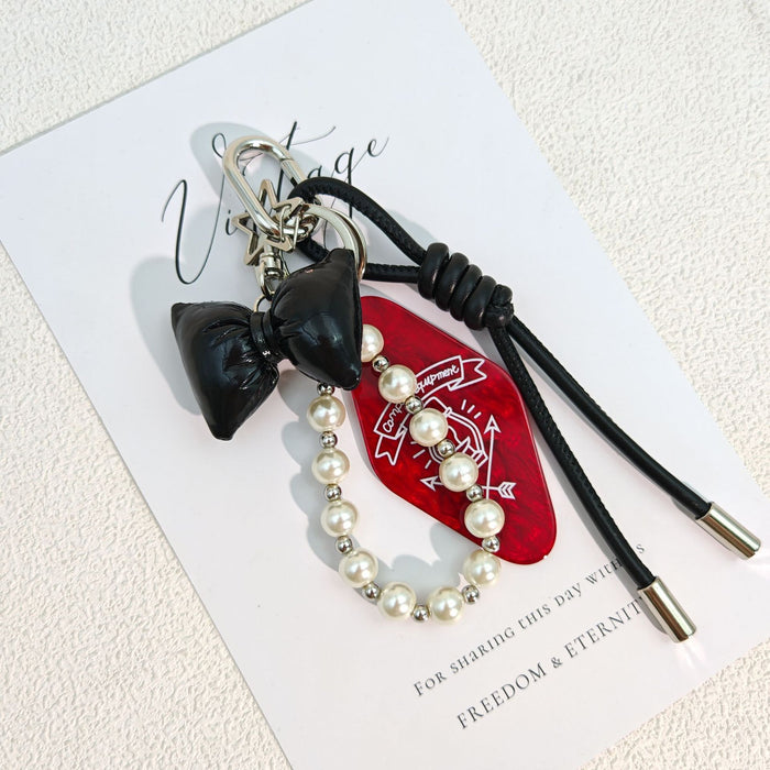 Wholesale Simple Bow Woven Leather Rope Pearl Chain Hanging Keychain