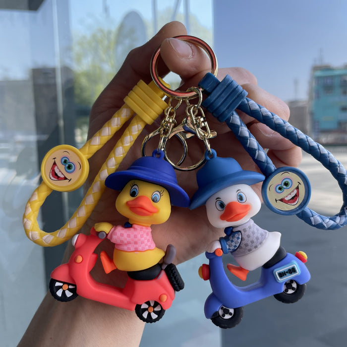 Wholesale Tram couple duck keychain couple backpack pendant claw machine doll car keychain exquisite small gift wholesale
