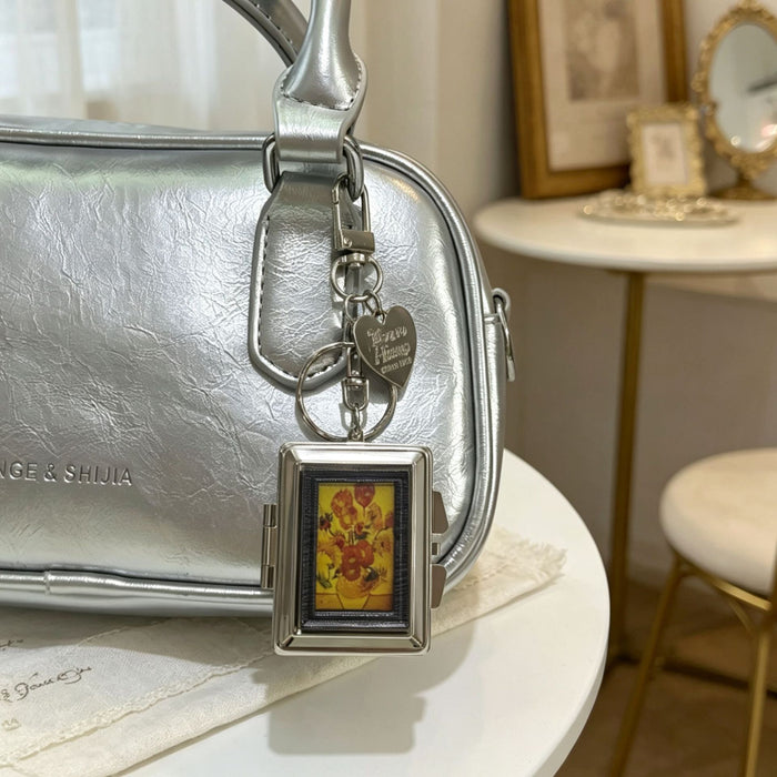 Wholesale Double-Sided Cosmetic Mirror Mona Pattern Bag Charm Keychain Zinc Alloy Boutique