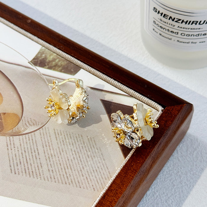 Wholesale Fashionable temperament, high-end earrings, light luxury, super fairy earrings, cat eye stones, double-sided flower ear buckles