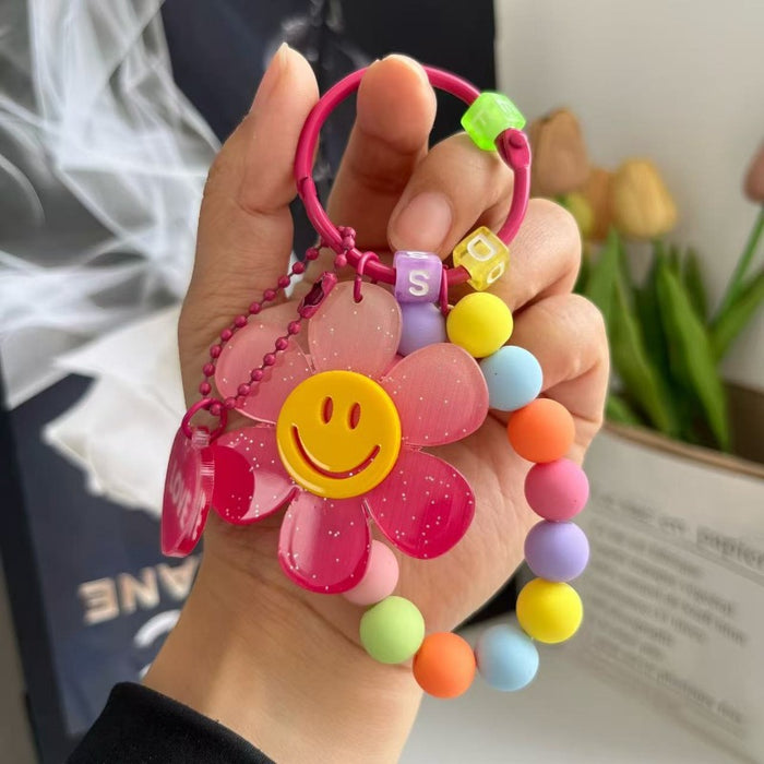 Wholesale Cute letter sunflower bag pendant with smiling face, colorful handmade bead key chain