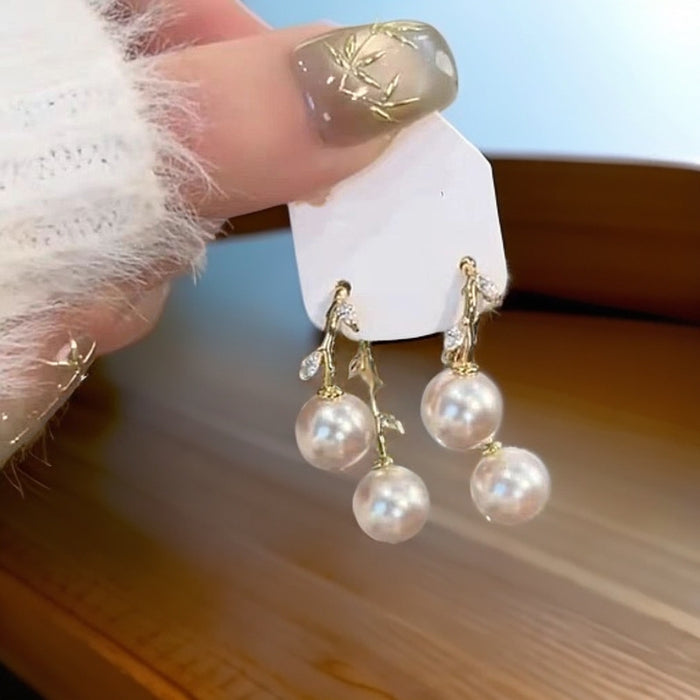 Wholesale A pair of cross leaf pearl earrings with light luxury temperament, fashionable and versatile ear accessories