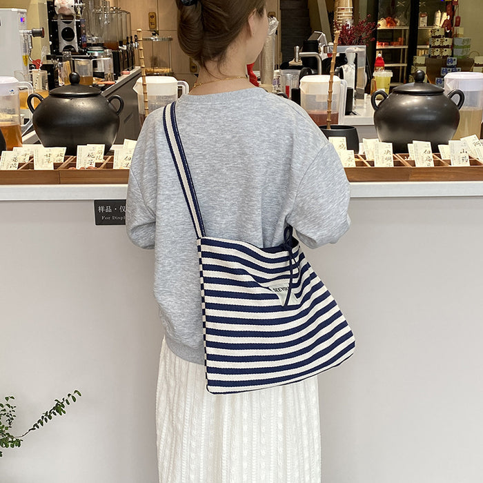 Wholesale New fashionable striped canvas bag with simple and large capacity letter printed double-sided crossbody bag, casual commuting shoulder bag