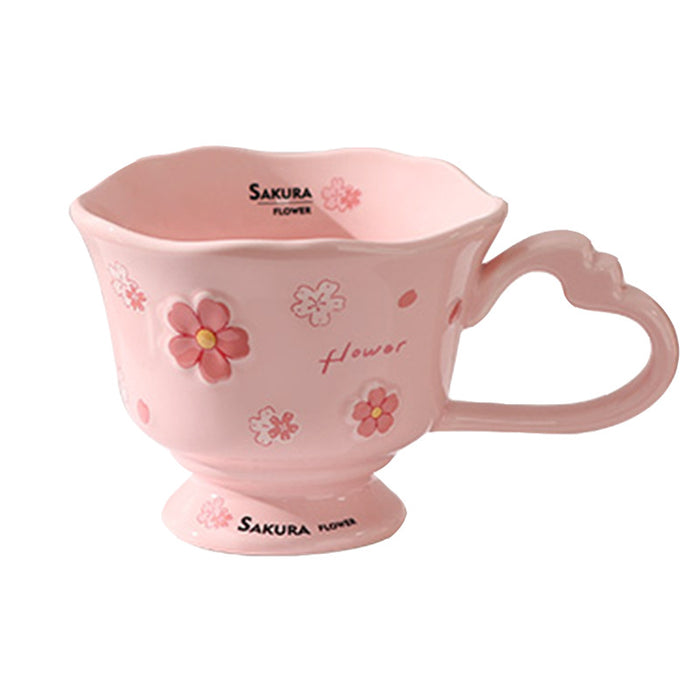Wholesale Pink ceramic stemmed cup with cherry blossom relief design and spoon