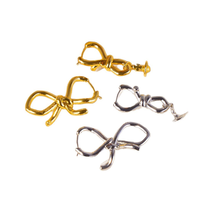 Wholesale Asymmetric bow, small Saturn, gold and silver earrings, niche design, light luxury