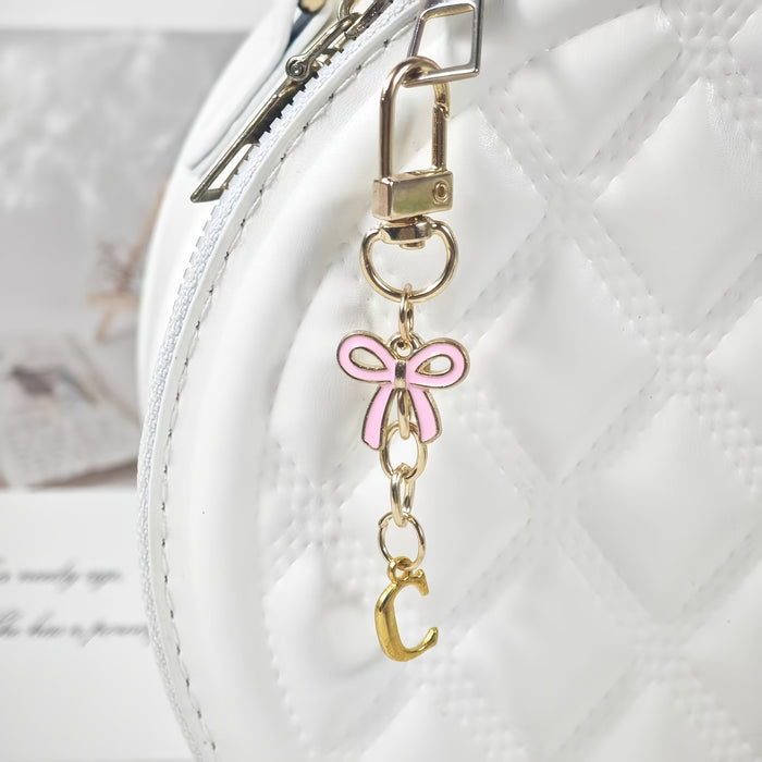 Wholesale Pink bow A-Z keychain alloy accessory