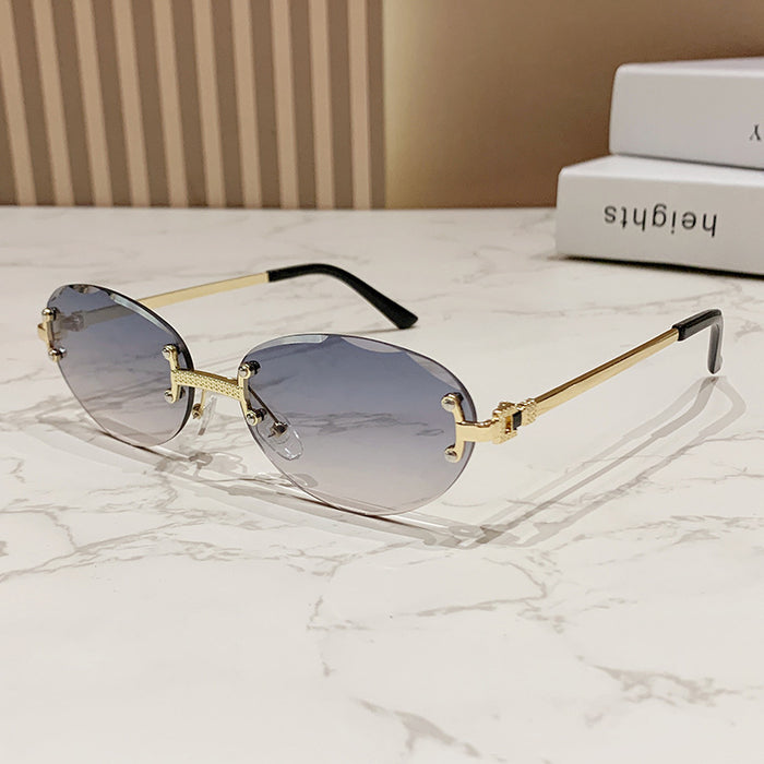 Wholesale Frameless cut sunglasses, fashionable oval frame glasses, gradient sunglasses