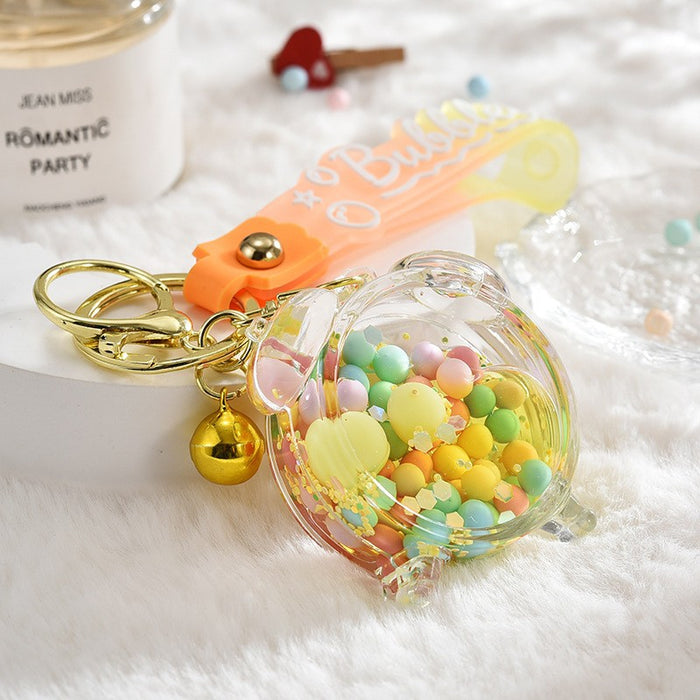 Wholesale Acrylic oil bottle candy Bean astronaut keychain