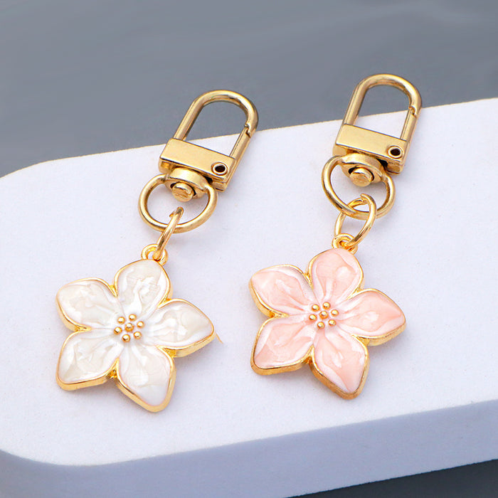 Wholesale Simple Dropping Oil Cherry Blossom Pendant Keychain Alloy Daisy Flower