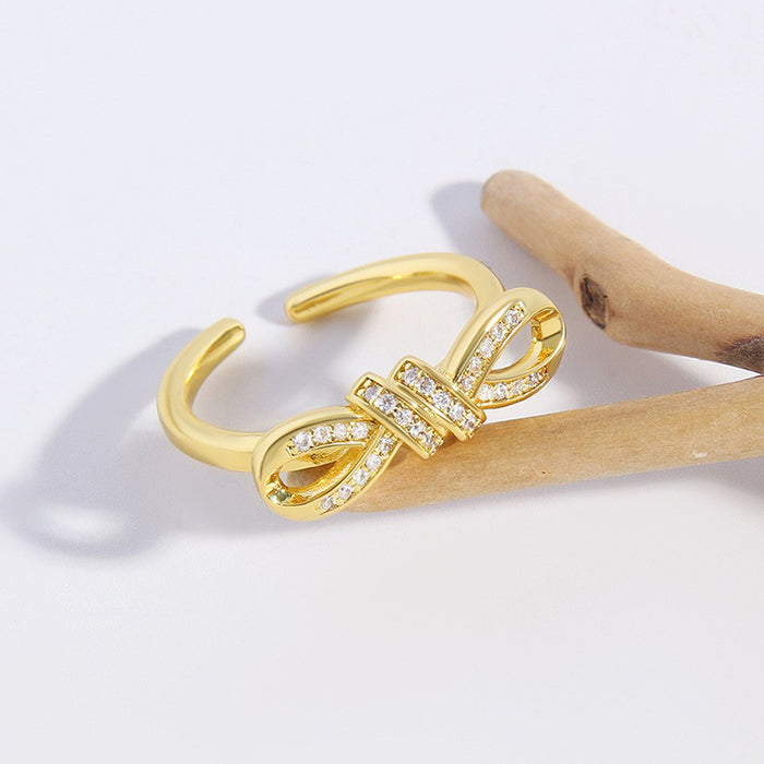 Wholesale Copper Gold Plated Irregular Zircon Twisted Rope Bow Ring JDC-RS-BaiTian004