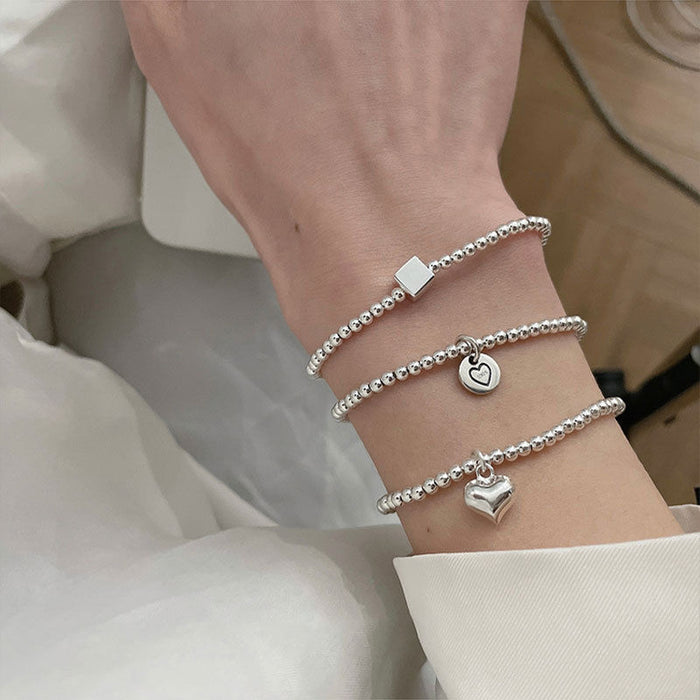 Wholesale Pure silver heart-shaped round bead bracelet with a new niche design, high-end feel, and light luxury bracelet accessories