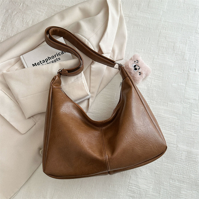 Wholesale Personalized retro tote bag for commuting, fashionable crossbody, simple shoulder bag