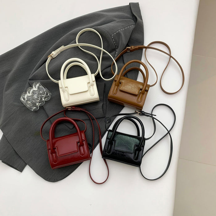 Wholesale New retro oil leather handbag for children, stylish mini parent-child crossbody bag