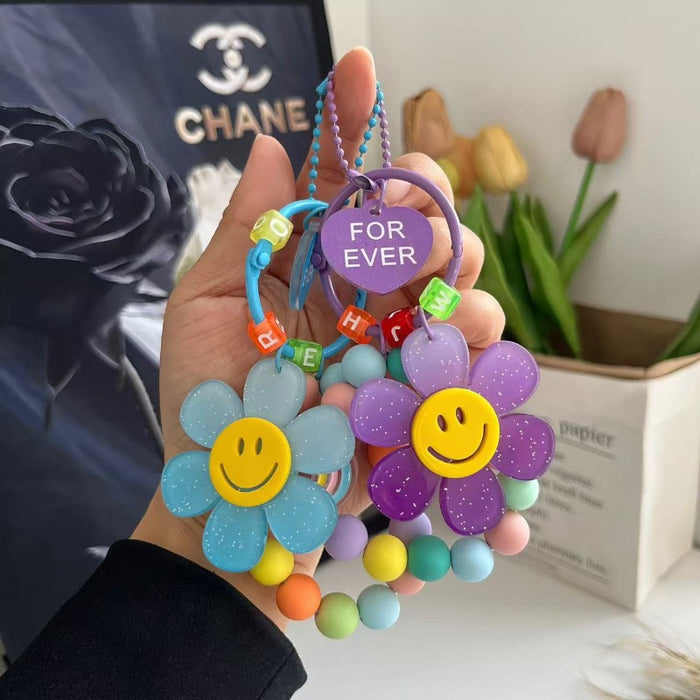 Wholesale Cute letter sunflower bag pendant with smiling face, colorful handmade bead key chain