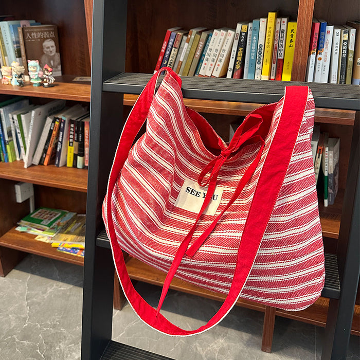 Wholesale Canvas striped large capacity fashionable simple versatile crossbody bag for work commuting tote bag
