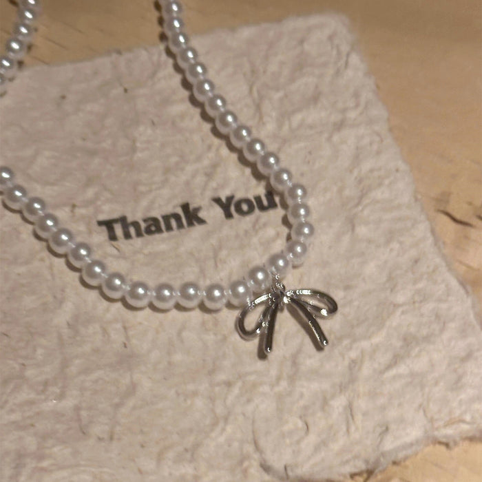 Wholesale Pearl bow pendant necklace, light luxury collarbone chain, niche high-end sense, temperament necklace