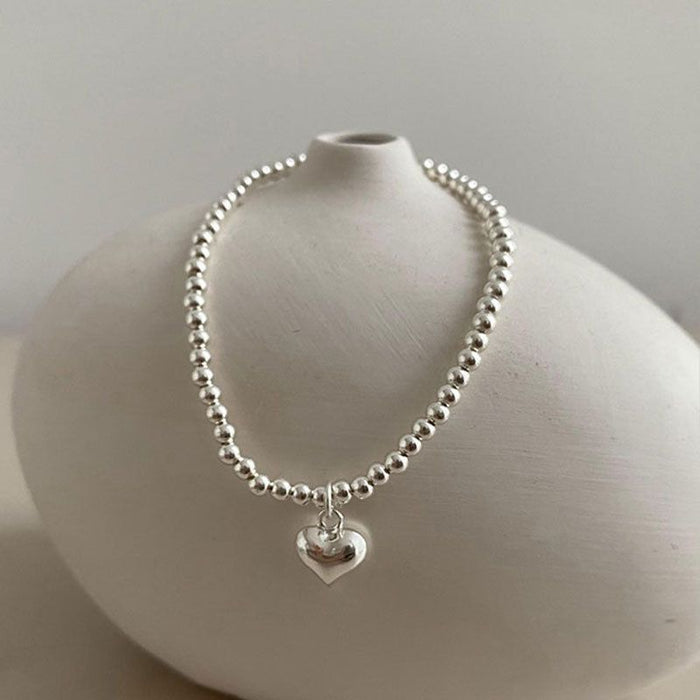 Wholesale Pure silver heart-shaped round bead bracelet with a new niche design, high-end feel, and light luxury bracelet accessories