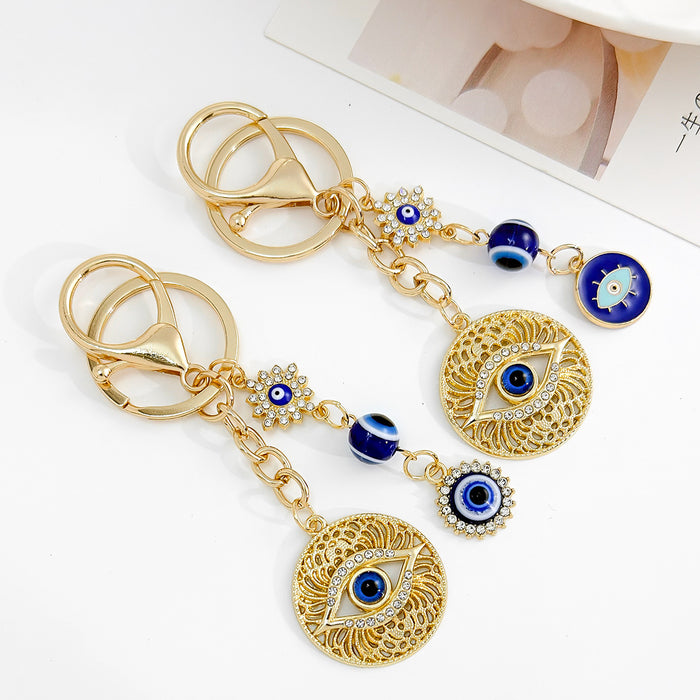 Wholesale Diamond-encrusted blue eyes evil eye tassel keychain