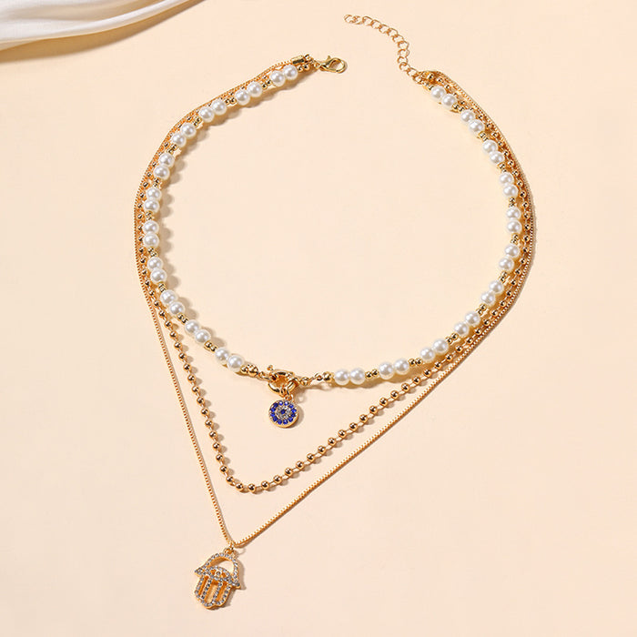 Wholesale New exaggerated jewelry alloy diamond inlaid multi-layer necklace for women, pearl eyes, palm pendant