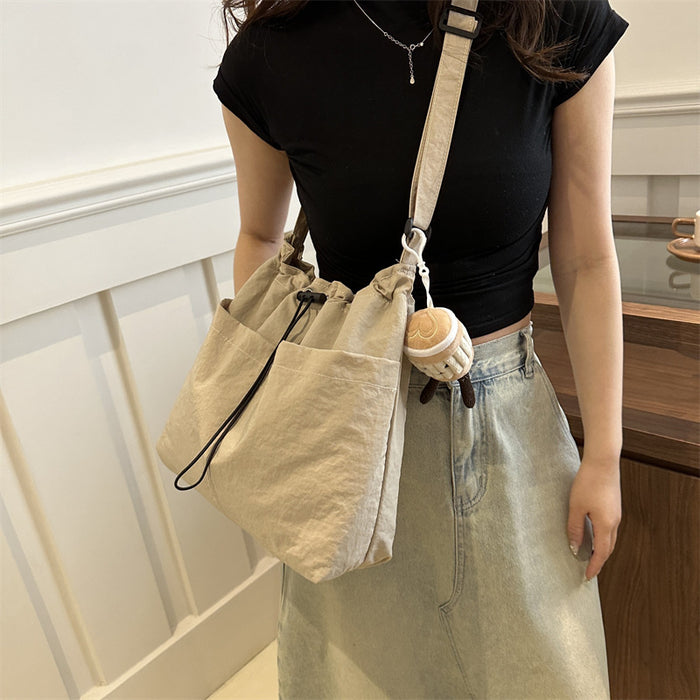 Wholesale Niche casual artistic canvas bucket bag, fashionable drawstring single shoulder pleated nylon crossbody bag