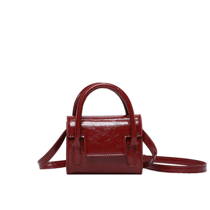 Wholesale New retro oil leather handbag for children, stylish mini parent-child crossbody bag