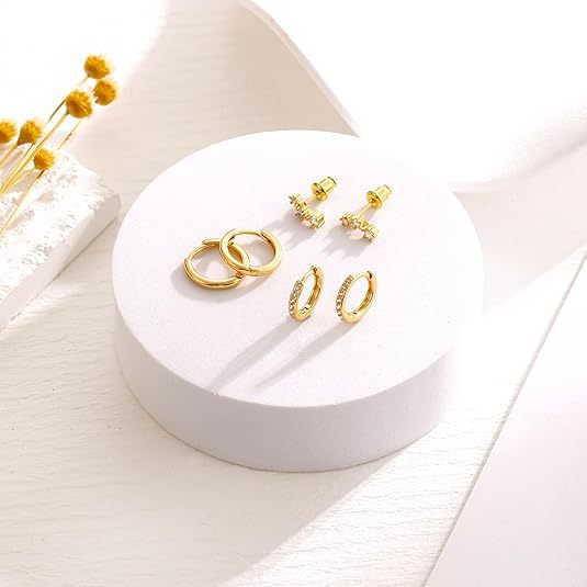 Wholesale Eight pointed star earrings copper plated with real gold, fashionable and niche design, star ear buckle wholesale