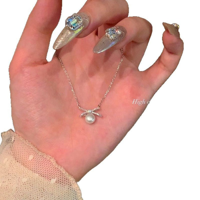 Wholesale Titanium steel pearl bow necklace, new high-end, light luxury collarbone chain accessory