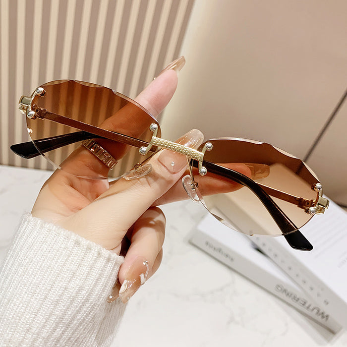 Wholesale Frameless cut sunglasses, fashionable oval frame glasses, gradient sunglasses