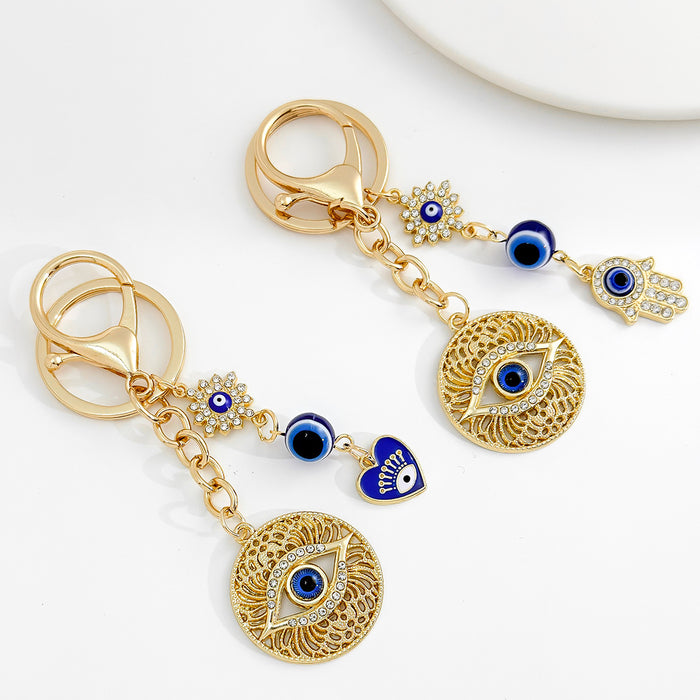 Wholesale Diamond-encrusted blue eyes evil eye tassel keychain