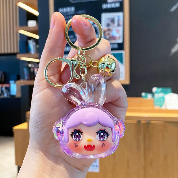 Wholesale Oil-flow sand earphone rabbit keychain