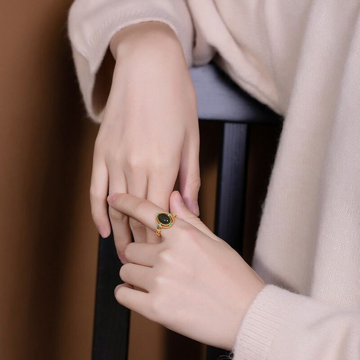 Wholesale Oval-shaped court-style ring with a green zircon stone