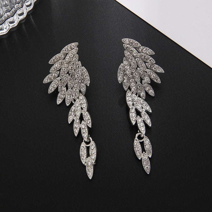 Wholesale Exaggerated earrings with fashionable tassels, long alloy and diamond studded earrings, crystal wing earrings