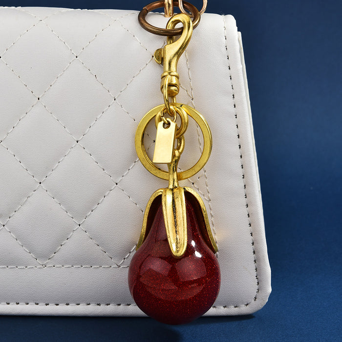 Wholesale Gilded pear-shaped couple keychains symbolizing eternal love