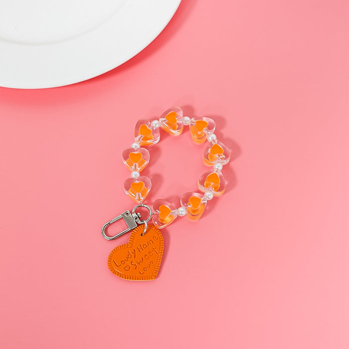 Wholesale fresh simple color love hand chain transparent acrylic chain mobile case accessories