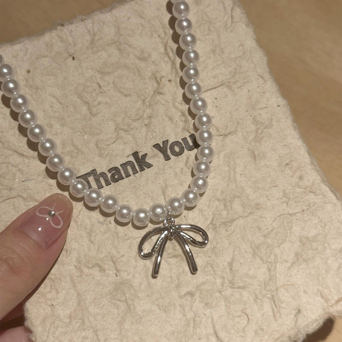 Wholesale Pearl bow pendant necklace, light luxury collarbone chain, niche high-end sense, temperament necklace