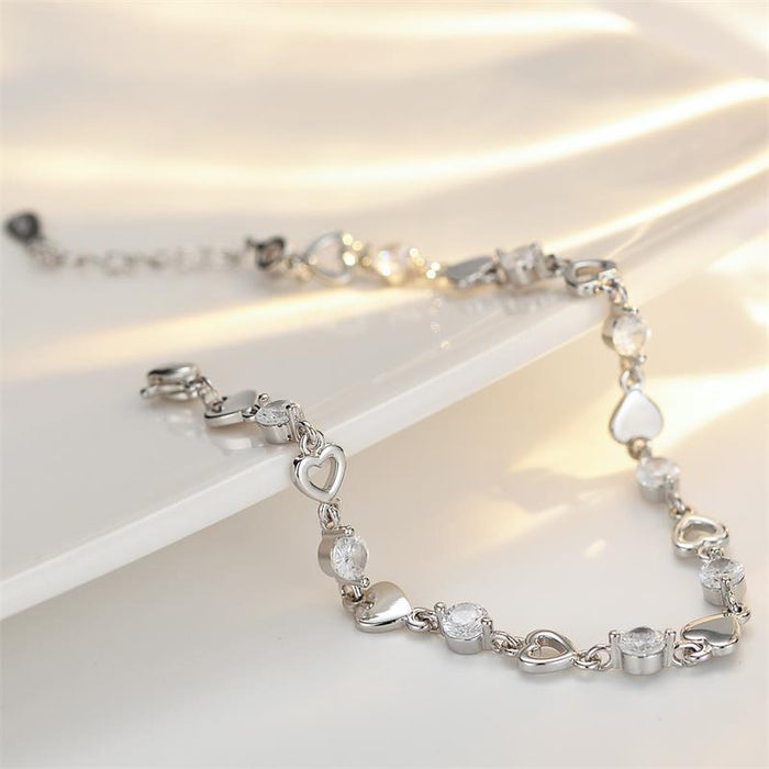 Wholesale Sweet and cool heart-shaped zircon bracelet with niche design, hollowed out heart-shaped bracelet, light luxury and versatile gift