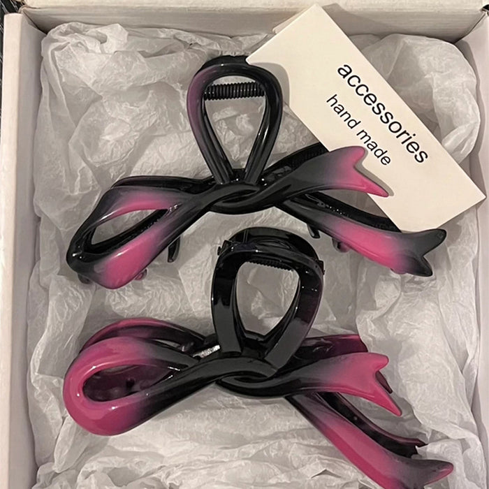 Wholesale Bow shaped acrylic hair clip for women's hair accessories with a high-end feel. Back of the head hair clip with a large shark clip