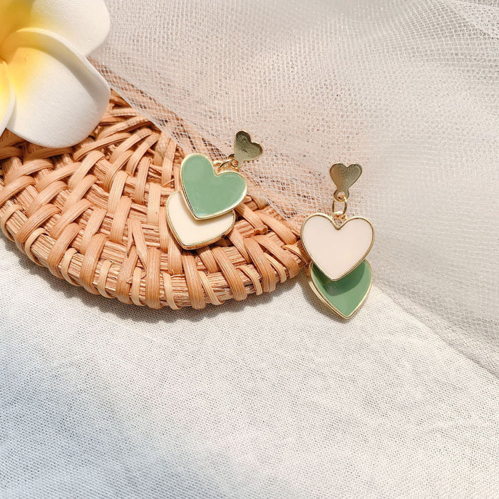 Wholesale Asymmetric temperament, heart-shaped earrings, peach heart, oil dripping earrings, silver needles