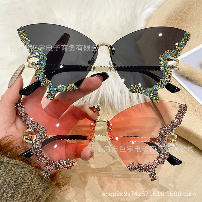 Wholesale Butterfly shaped diamond studded frameless sunglasses for women with fashionable personality and exaggerated sunglasses