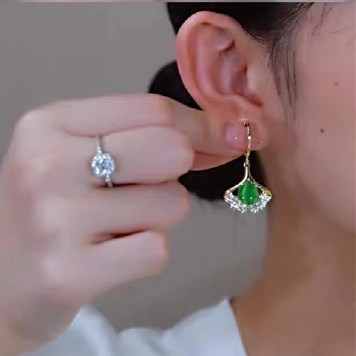 Wholesale Personalized cat eye stone ginkgo leaf earrings with niche design, high-end and trendy ear loops and accessories